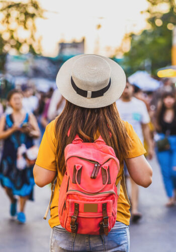 Back side of Young Asian traveling women walking and looking in chatujak weekend walking street market in evening time at Bangkok, Thailand, traveler and tourist,walking street and food market concept