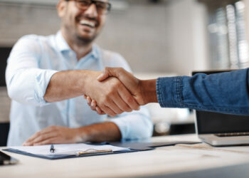 Close up of handshake in the office